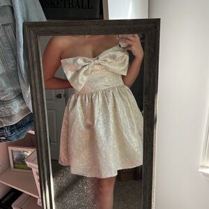 Strapless metallic bow dress